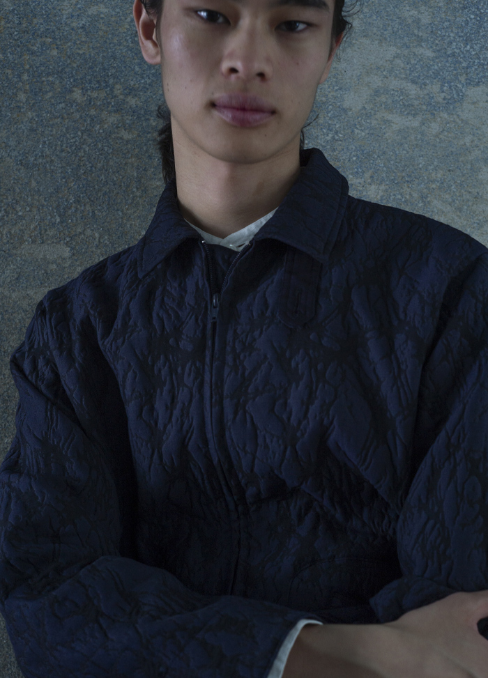 a man wears jacket of jacquard series.